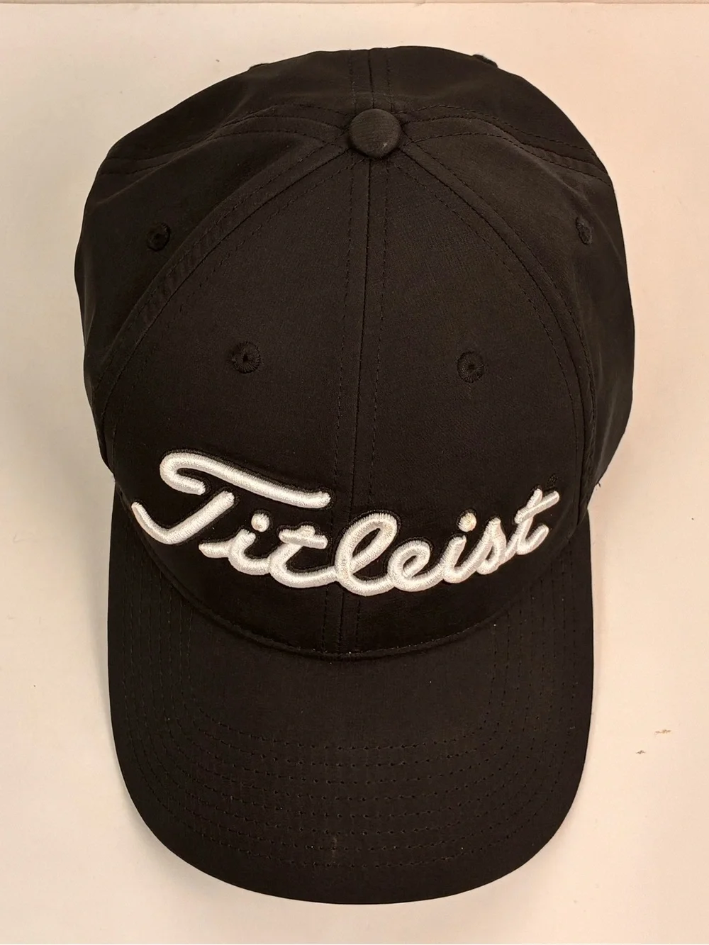 Titleist Tour Performance hat featuring embroidered Spectrum on the back OS